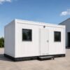 White cargo container office exterior with clean panel cladding, one main door, two windows, black base frame, and portable office step