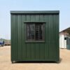 Forest green container building side view showing the 15-foot-deep MS-clad wall.