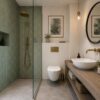 Boutique container hotel cottage bathroom with walk-in shower, wall-hung WC, vessel basin vanity, and matte sage-green tile