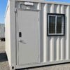 Close-up detail of container site office steel door aluminium window and MS safety grill