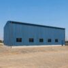 Side elevation of a blue engineered steel structure showing its full 60-foot length