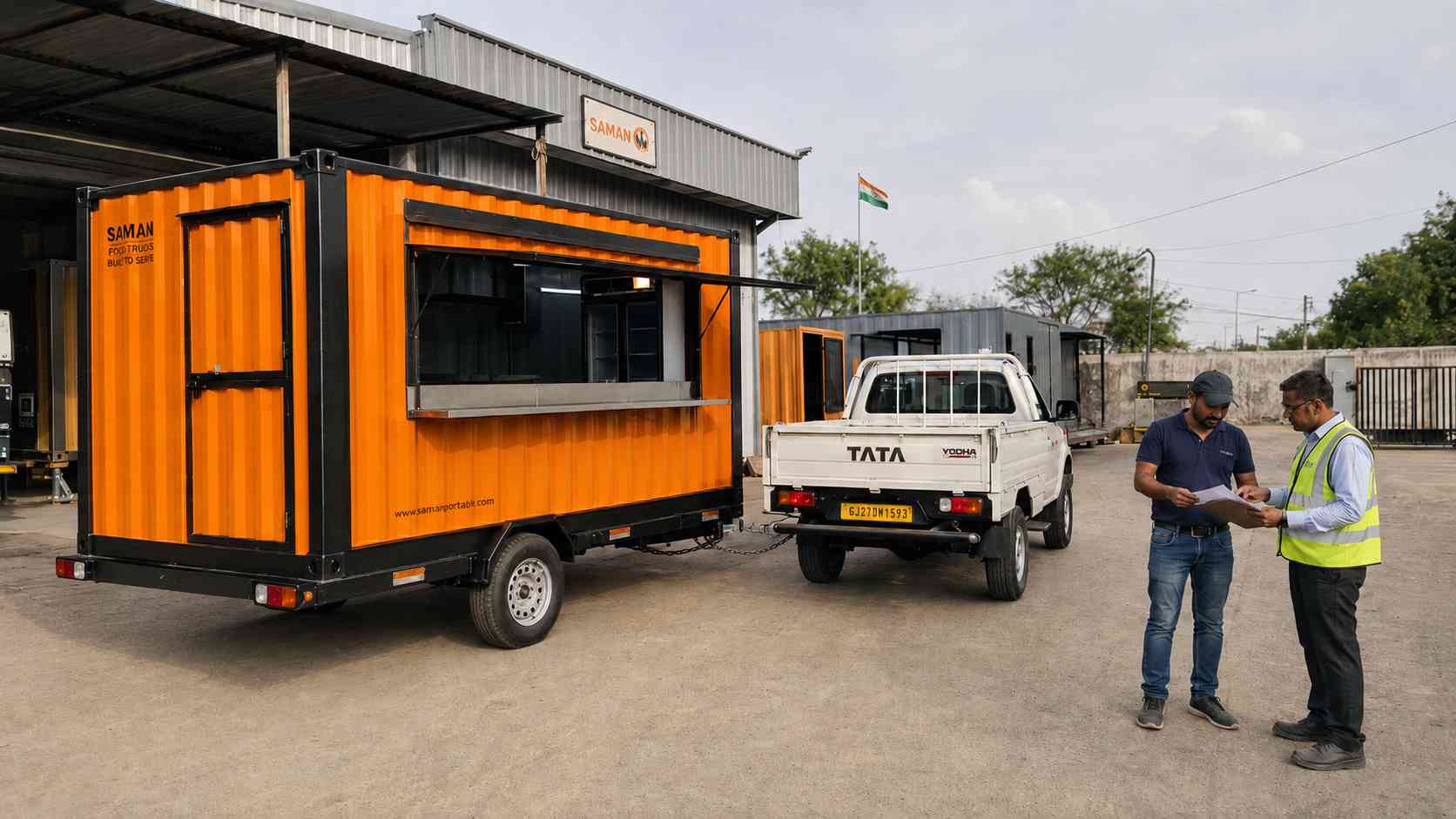 SAMAN plant supervisor handing chassis paperwork to a buyer at Day-15 tow-away with the orange food truck container hitched to a pickup.
