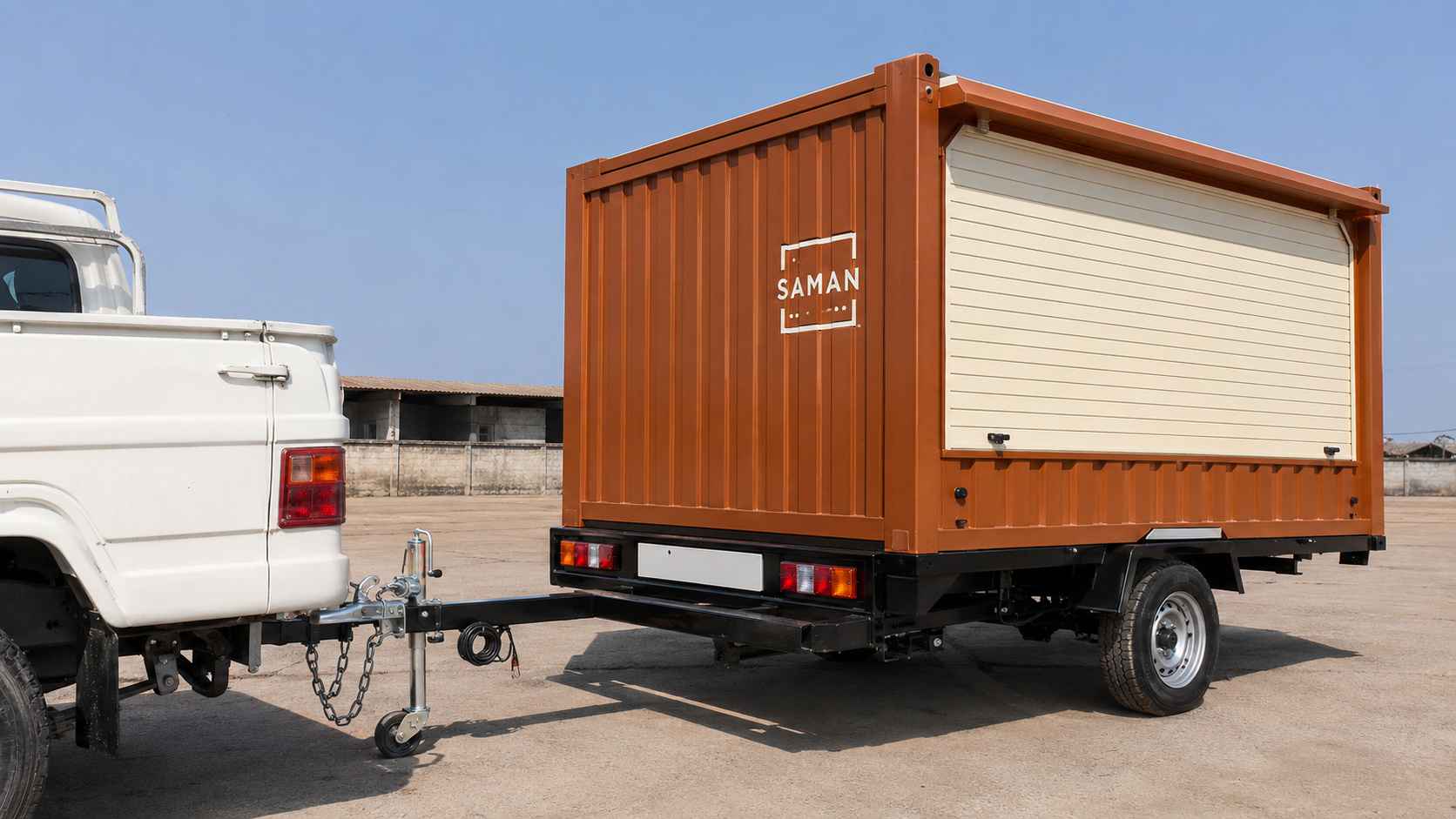 Mahindra Bolero Pickup hitching to a SAMAN food truck container's trailer chassis with 50 mm ball coupler and safety chains.