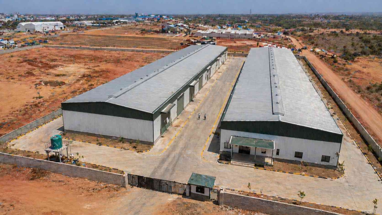 PEB construction multi-bay factory complex aerial India industrial zone SAMAN
