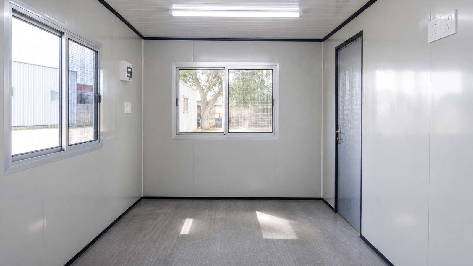 Interior of MS corrugated porta cabin with standard electrical and window fitout