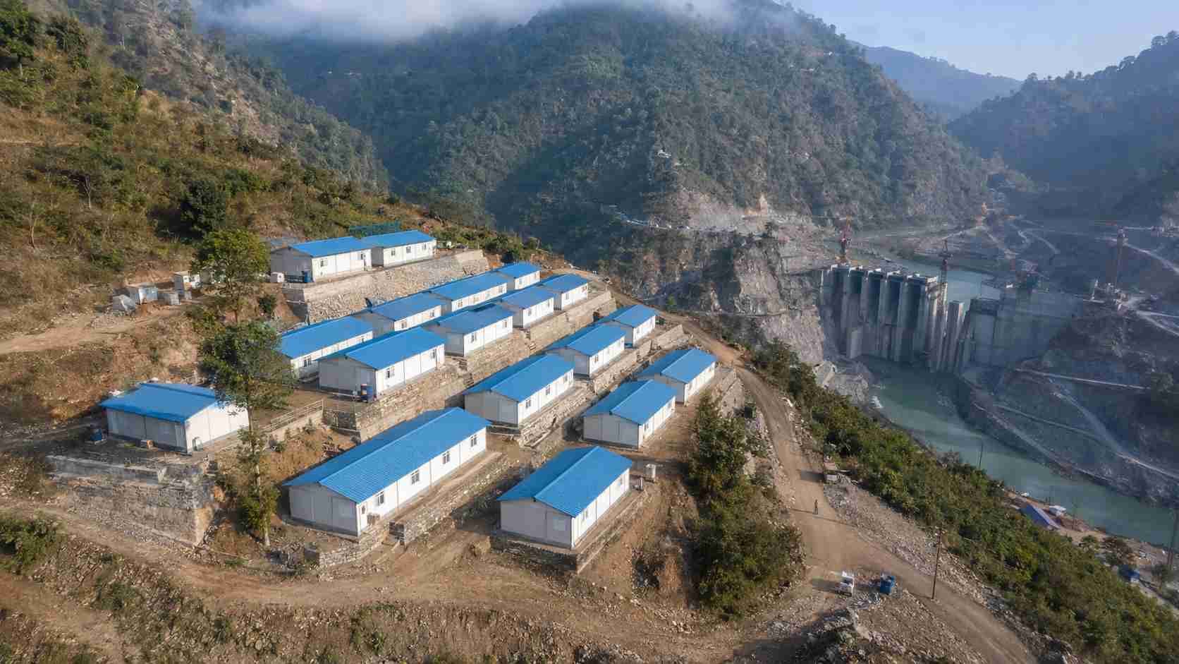 SAMAN labor cottages at an Indian hydropower dam project site on stepped levelled platform in hilly terrain