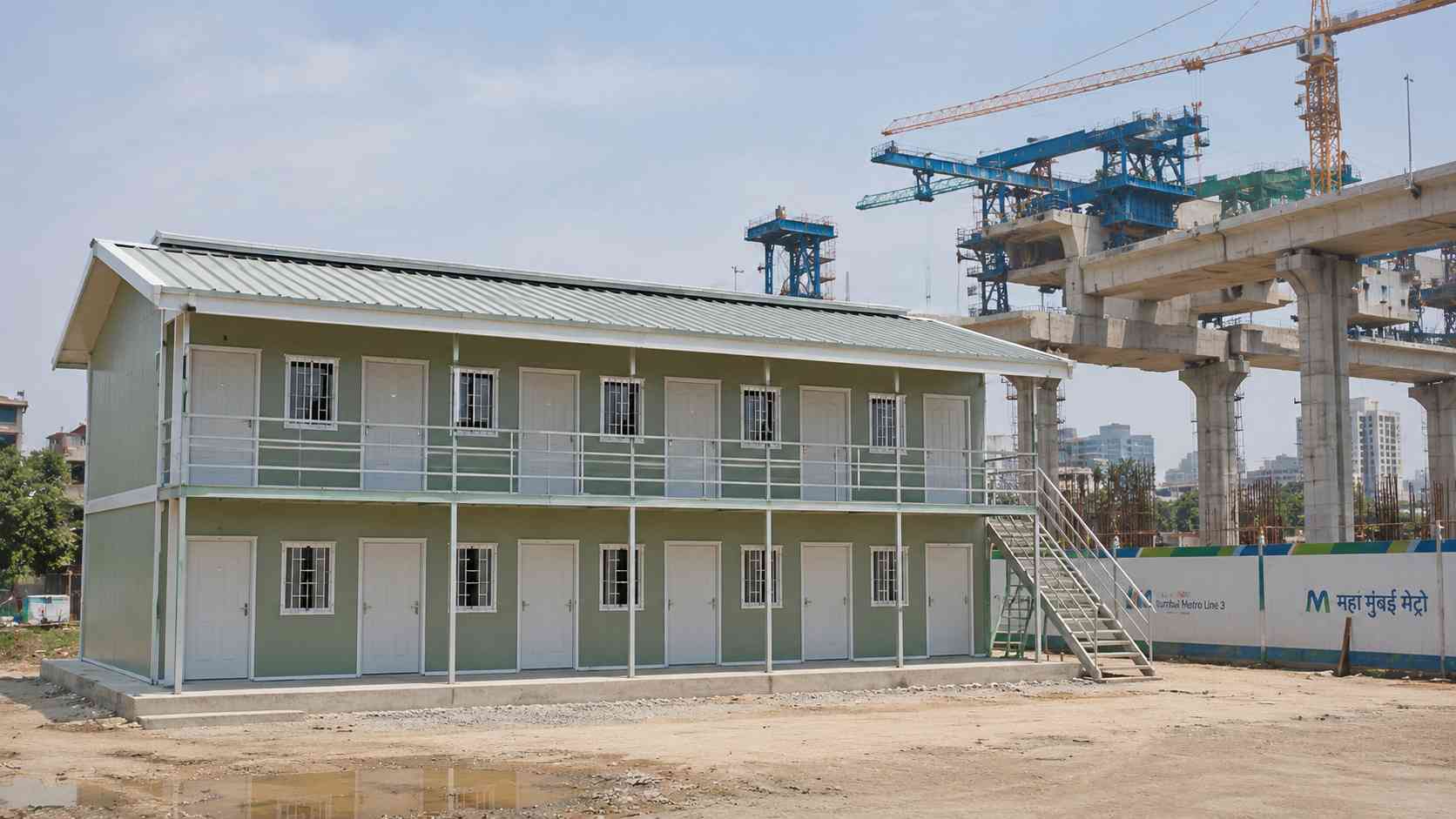 Two-storey G+1 SAMAN labor shed at a metro construction project compound in an Indian city