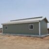 Side elevation of a SAMAN labor shed showing full roof span and PPGI cladding