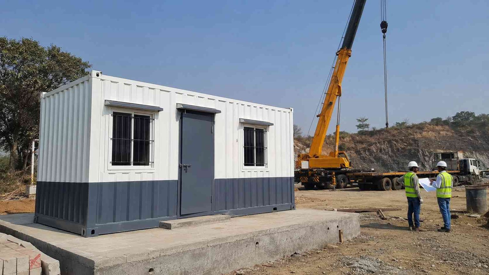Mobile office container deployment at construction site