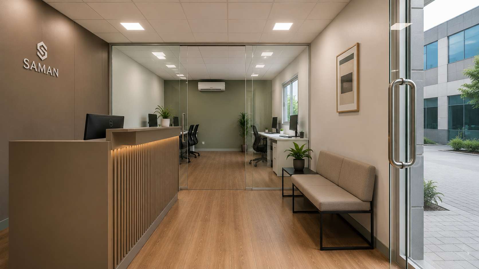 Reception-and-cabin layout inside a modern office cabin showing the front counter and glass partition to the work zone behind