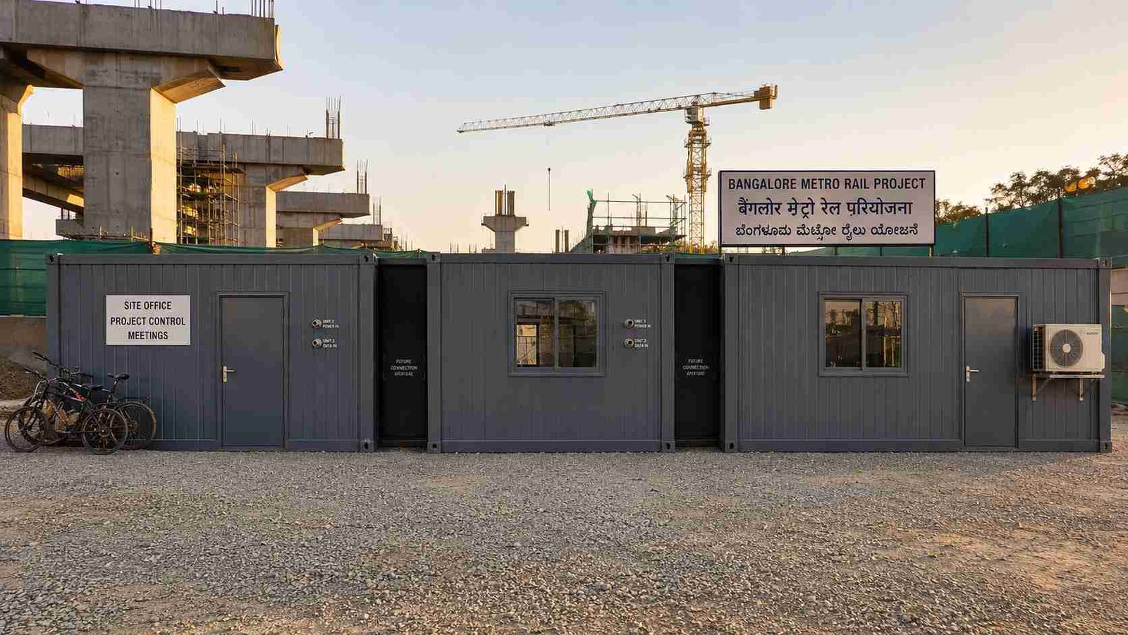 Slate Charcoal SAMAN modular container office in three-unit linear configuration at Indian metro rail construction site.