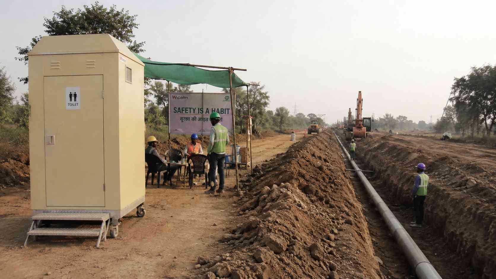 Movable toilet cabin at a pipeline corridor where work advances along the trench line