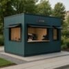 Green Porta Cabin coffee kiosk with serving windows