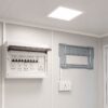Factory-fitted electricals inside SAMAN portable office cabin — MCB board, AC bracket, LED ceiling panel
