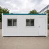 Portable office cabin side view — sliding aluminium windows with MS grills and weather-sealed steel door