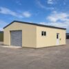 Red portable shed with two white roller doors on a working site yard