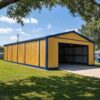 Yellow pre-engineering structure with blue trim, long side elevation showing the full single-bay length.