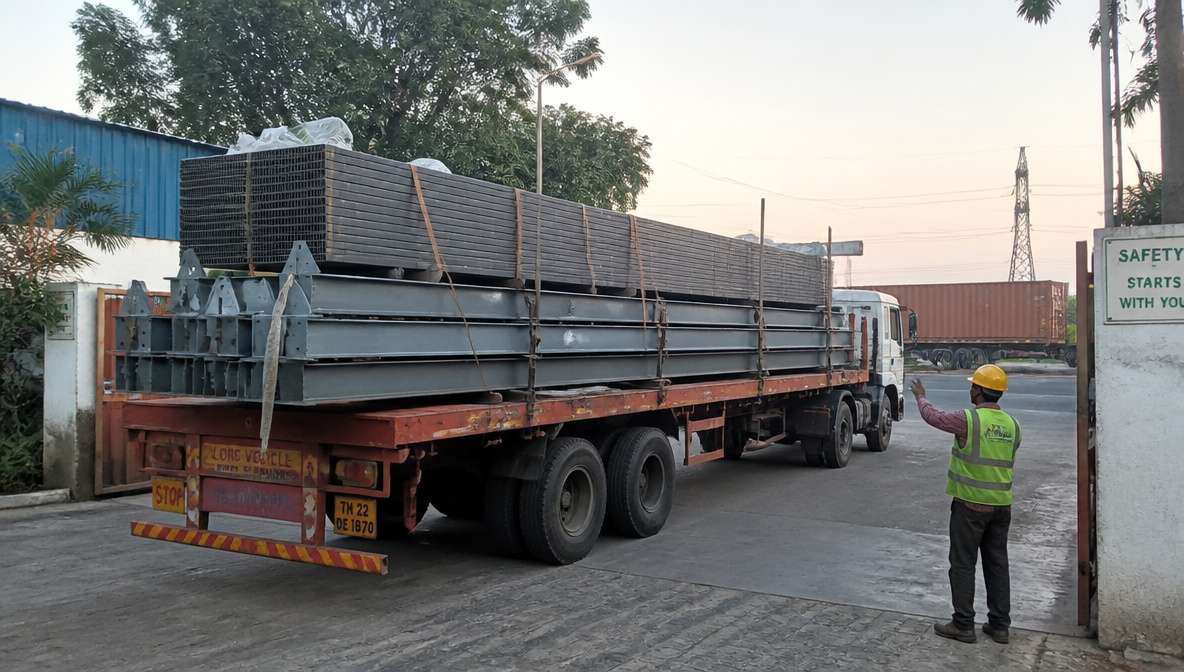 Truck loaded with prefab building steel members and panels dispatched from a SAMAN plant.