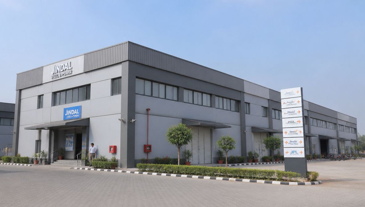 Multi-bay grey prefab commercial building with several entrances on an Indian commercial site.