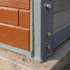 Close-up of a SAMAN prefab labor shed PUF panel sealed to its MS frame showing zinc phosphate primer and polyurethane topcoat finish
