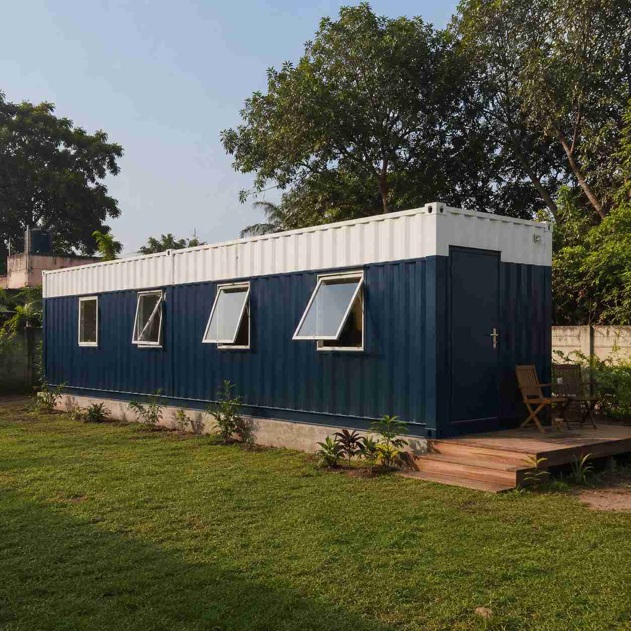 prefabricated-container-house-hero-bangalore-plot Navy blue and white prefabricated container house at 40×12 ft on a Bangalore plot
