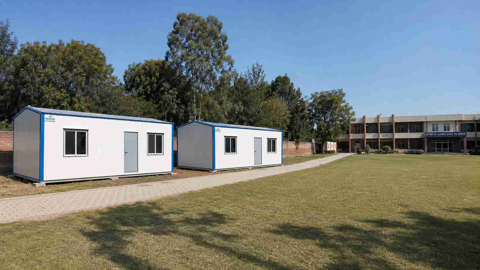 Two prefabricated office cabins added to a school campus as part of a multi-campus institutional rollout