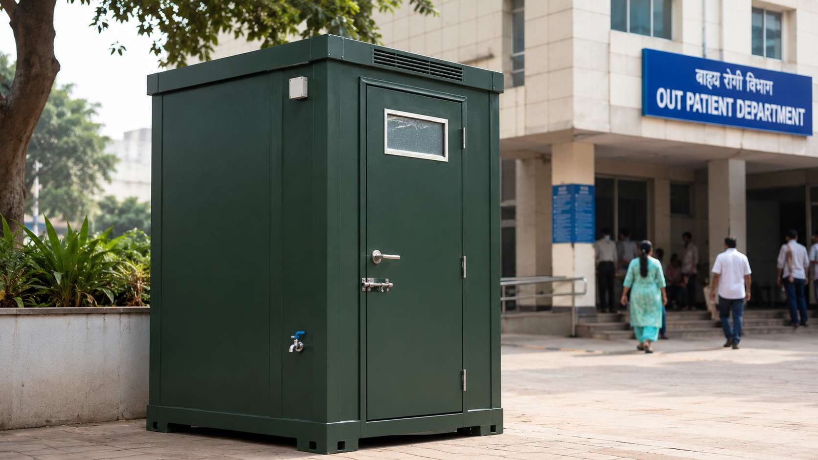 Forest green prefabricated toilet installed in the grounds of a hospital