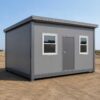 20×15 ft prefabricated building with steel grey panels, metal frame, finished roof, windows, and entrance door on level ground