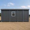 Side profile of 20×15 ft prefabricated building showing 8.6 ft height, bolt-down anchor points, insulated panels, and finished roof