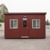 Burgundy red SAMAN prefab office cabin front elevation with centred door and two windows.
