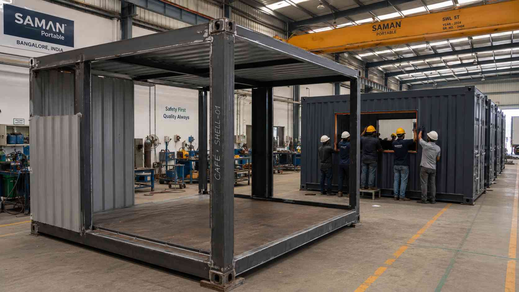 SAMAN Portable Bangalore factory floor showing new-fabricated shipping container cafe shells in build — ISO container frame and corner castings