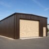 Close view of a brown steel shed showing ribbed wall cladding and a cream roller shutter