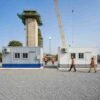 Two container site office cabins placed side by side at an Indian infrastructure construction compound