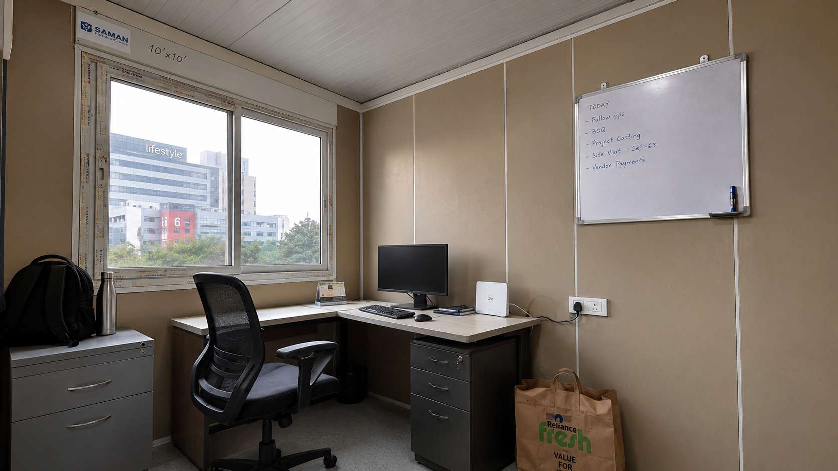  Interior of a 10x10 ft SAMAN porta cabin used as an SME admin office in Noida, with Warm Taupe PUF panel walls.
