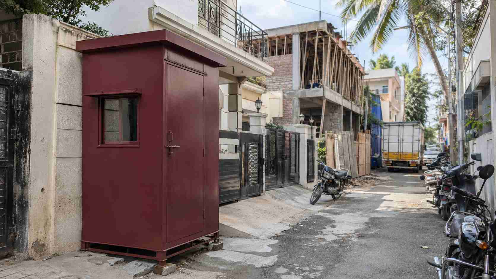 Burgundy Red 6×6 ft mini porta cabin delivered to a JP Nagar Phase 7-9 narrow lane plot.