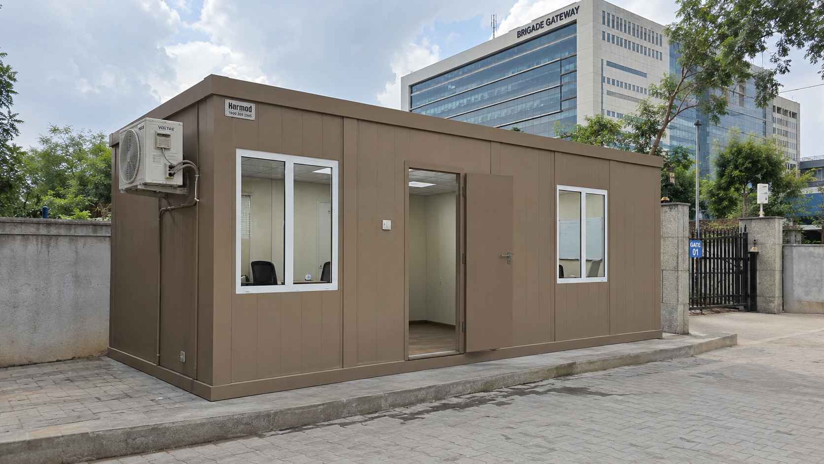 Warm Taupe multi-room porta cabin at a Malleshwaram education campus, AC-ready, with Brigade Gateway commercial buildings in background.