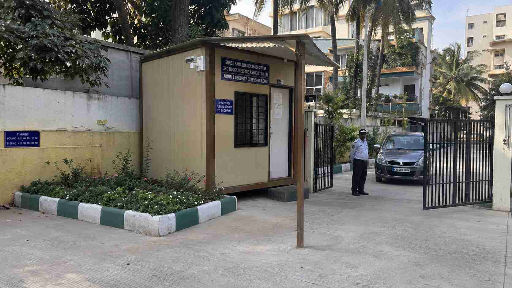 Sandstone Beige porta cabin used as a BDA-society RWA-extension admin room in a Banashankari residential layout.