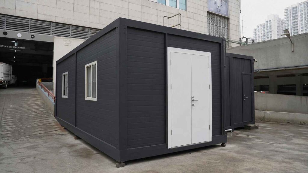 Anthracite grey porta cabin installed inside a Phoenix Marketcity parking-deck slot, Marathahalli, Bengaluru.