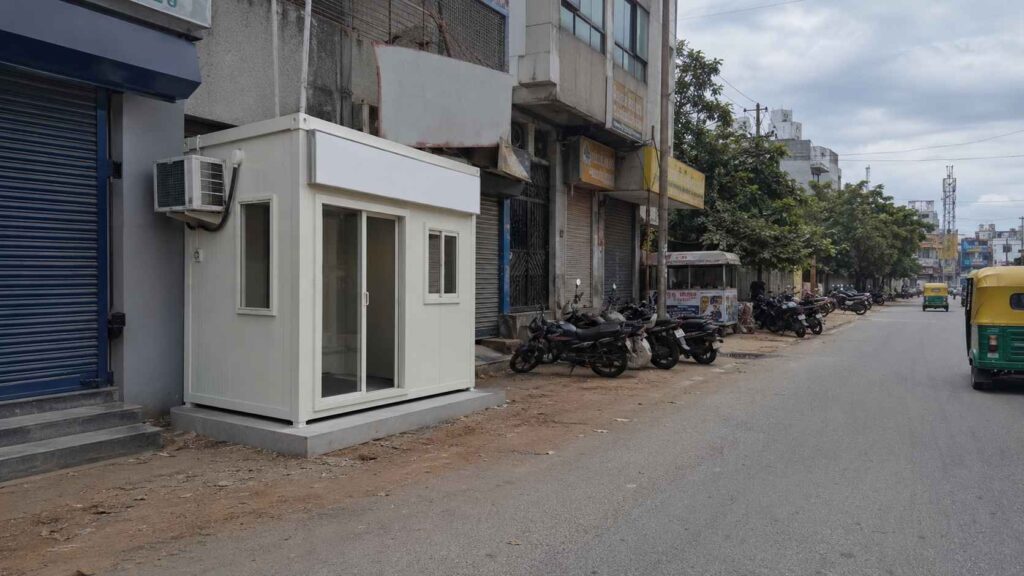 Pure White SAMAN porta cabin installed as a clinical diagnostic-lab frontage on Bannerghatta Road in JP Nagar.