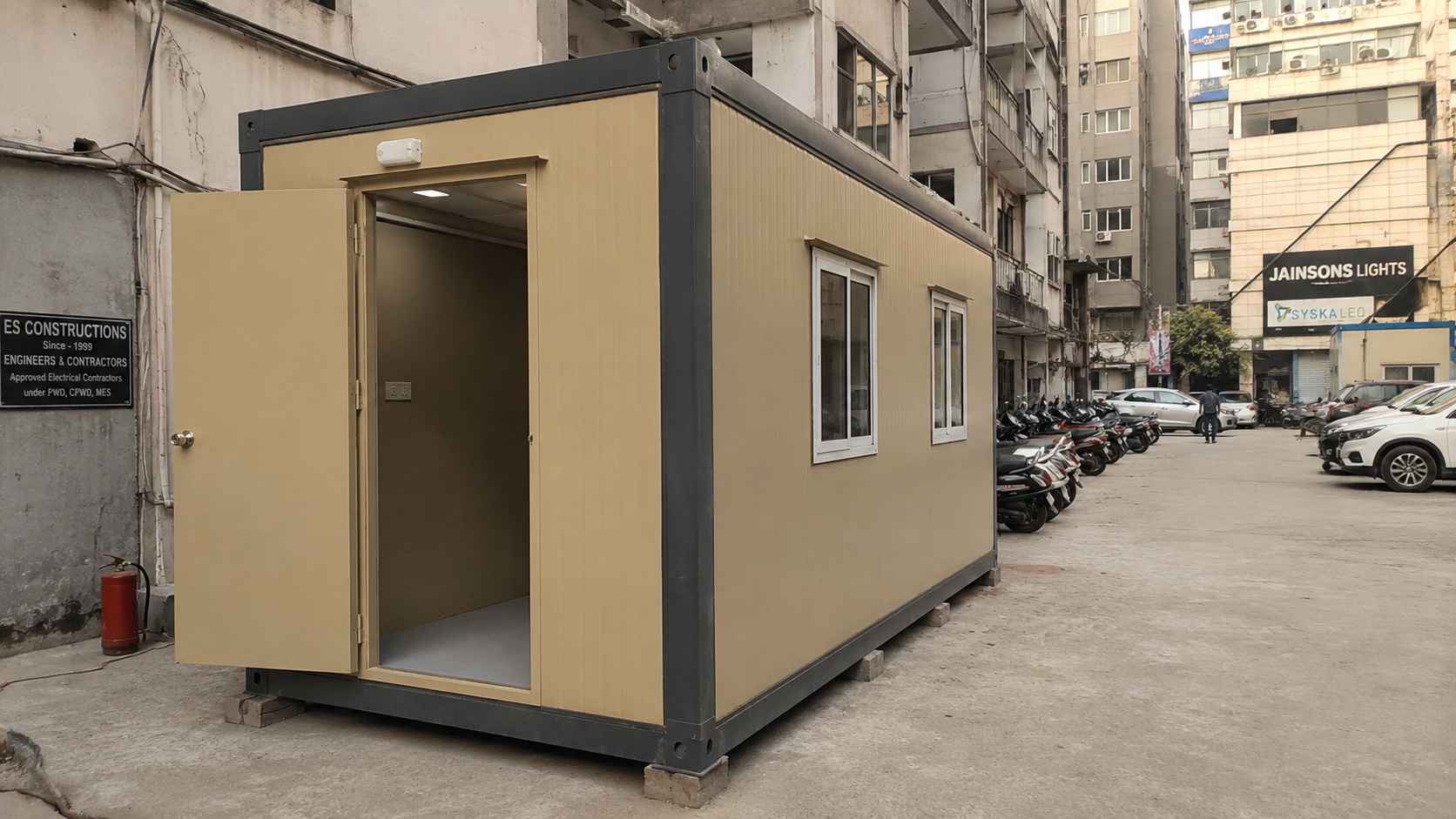 A Sandstone Beige 15×10 ft portable cabin at a Delhi commercial compound showing the most common SME office size.