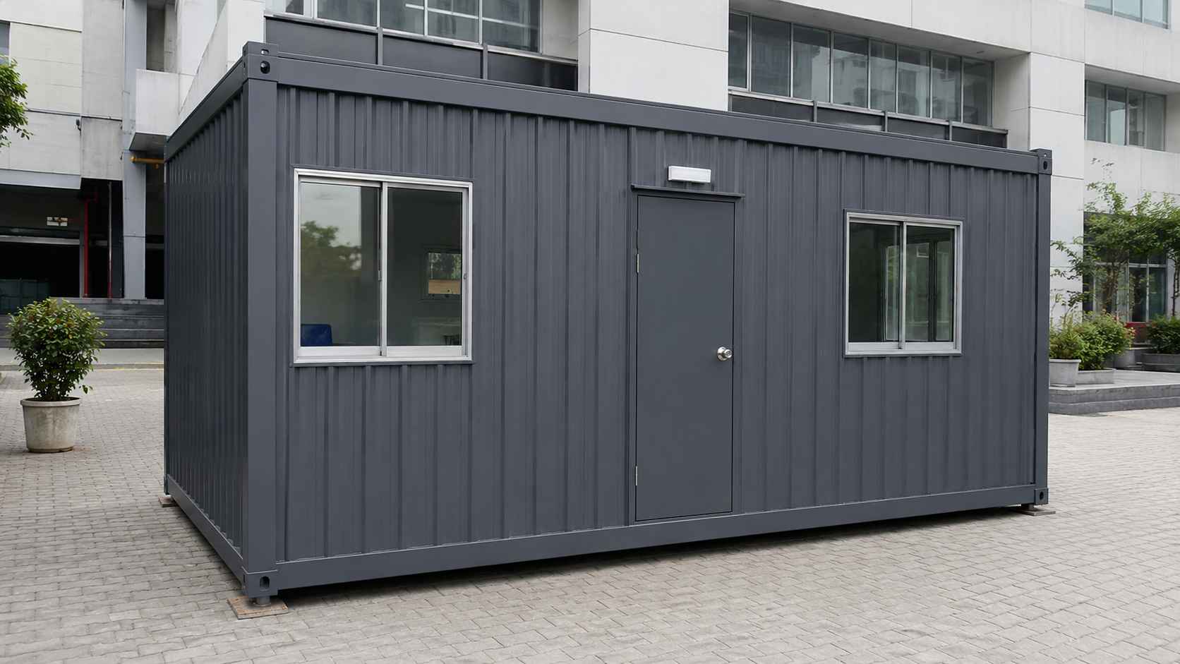 Slate charcoal portable office cabin installed on a corporate compound in Bangalore.